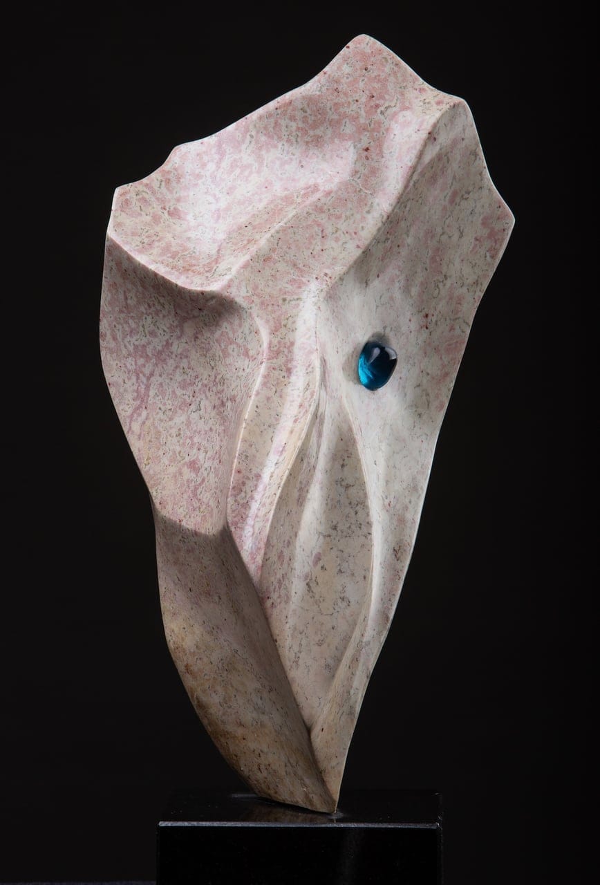 Blue Eyed Girl Too by Tom Ashbourne SSC SCA OSA, Rose alabaster, blue glass, granite base, 2023